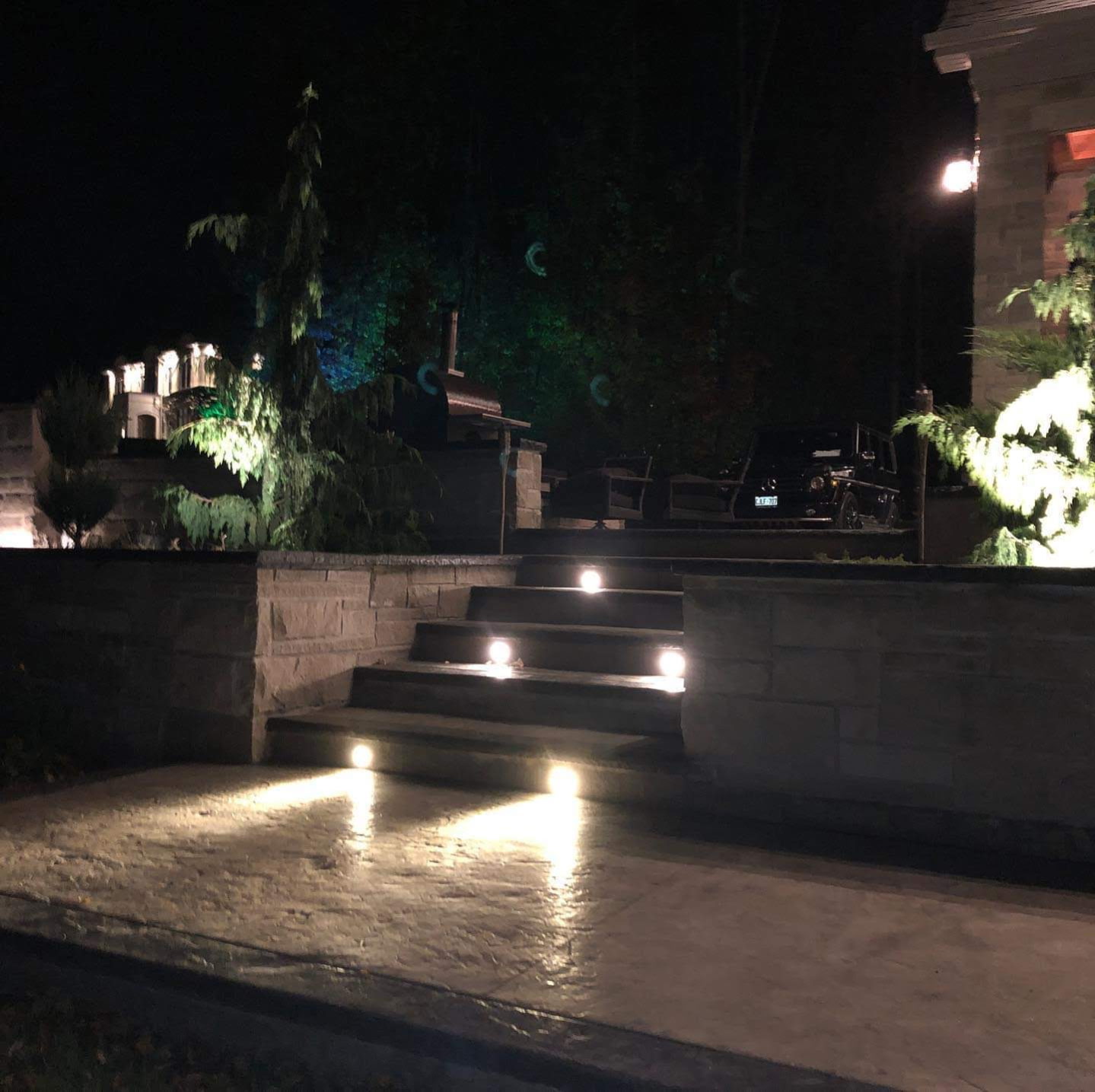 Same stairs at night with the step lighting fully lit